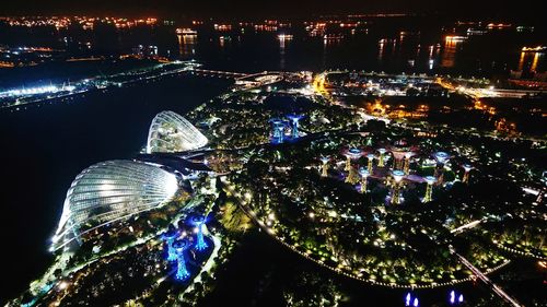 High angle view of illuminated city buildings at night
