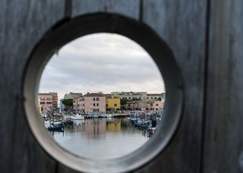 Canal and houses in town seen through window