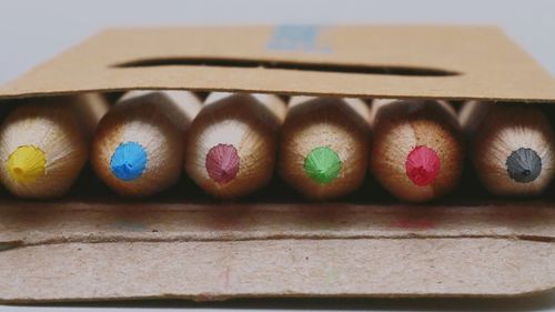 Close-up of multi colored pencils on table