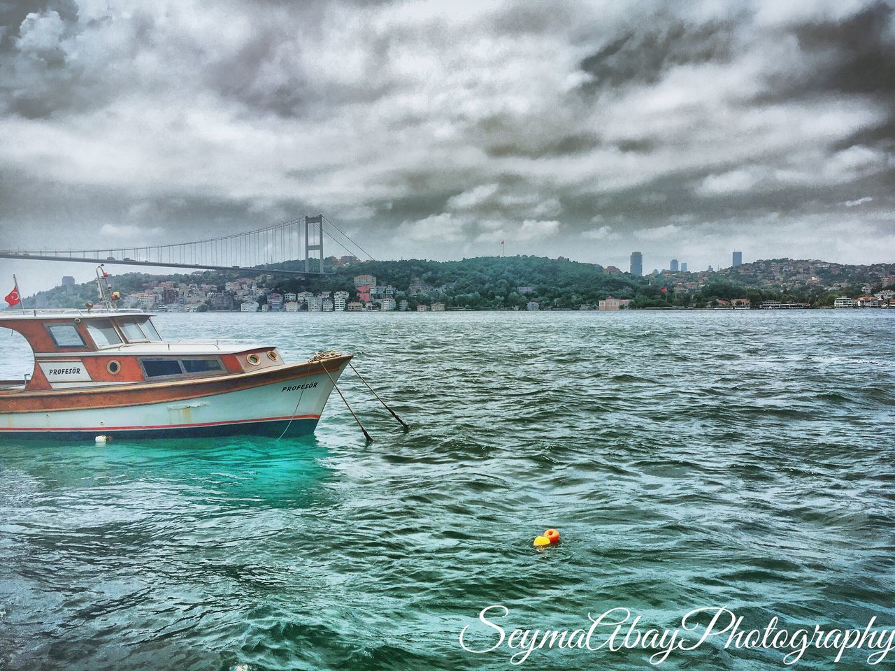 nautical vessel, water, transportation, sky, mode of transport, cloud - sky, boat, waterfront, sea, cloudy, rippled, cloud, moored, sailing, nature, sailboat, tranquility, built structure, overcast, day