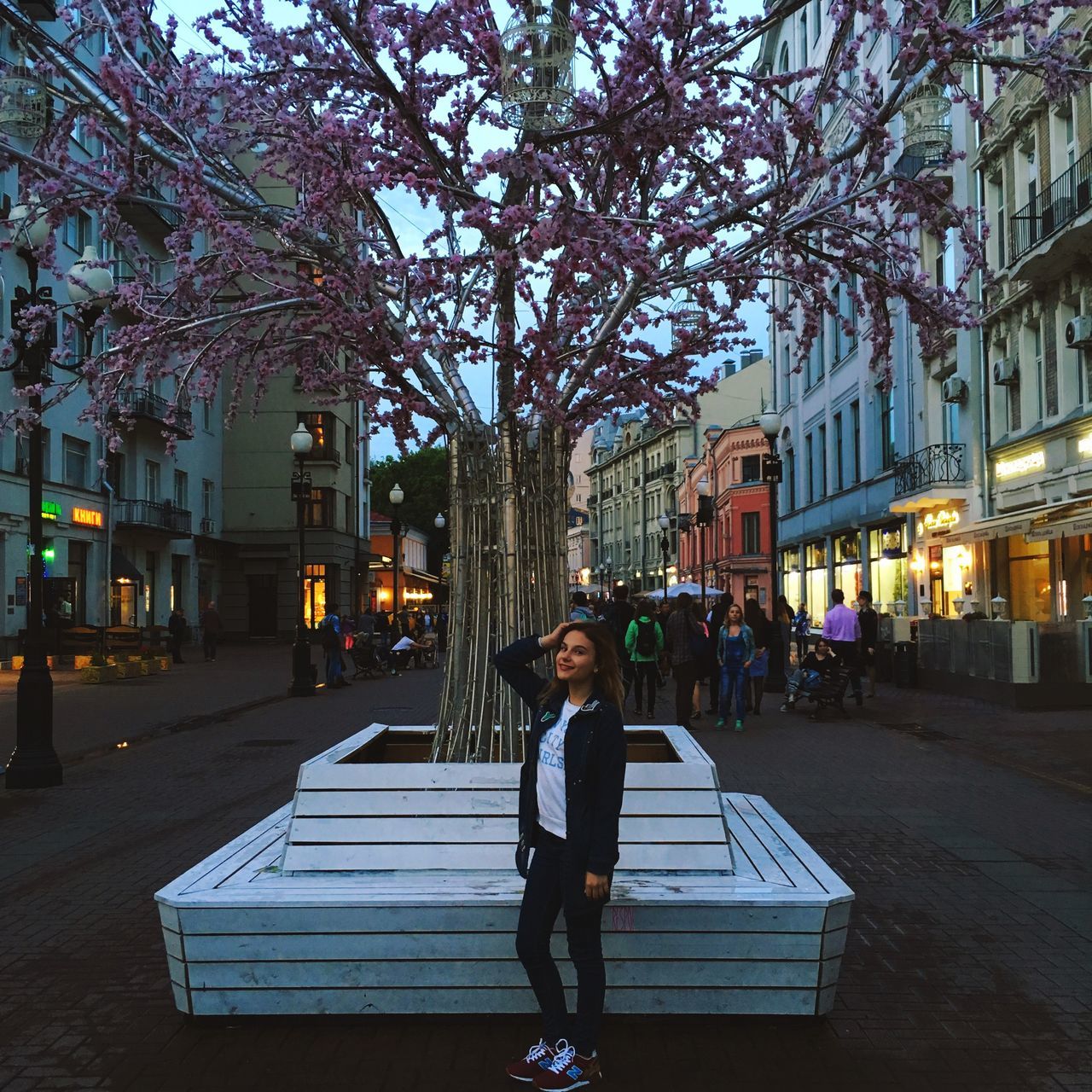 tree, one person, full length, building exterior, outdoors, real people, architecture, growth, young adult, city, night, people