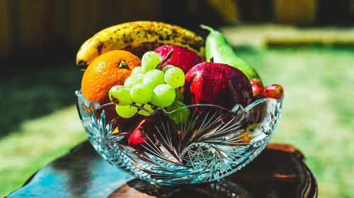 Close-up of fruits in basket on table