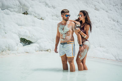 Romantic couple standing in lagoon