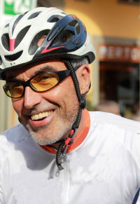 Portrait of smiling man wearing bicycle helmet