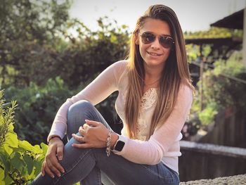 Close-up of woman sitting outdoors