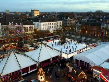 High angle view of people at christmas market in city