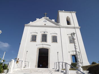 Low angle view of building against clear blue sky
