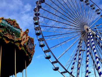 Low angle view of ferris wheel against sky