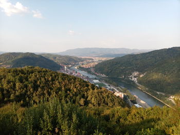 Scenic view of landscape and river against sky