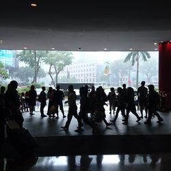 Group of people walking in front of building