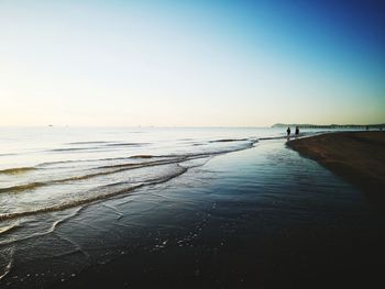 Scenic view of sea against clear sky during sunset