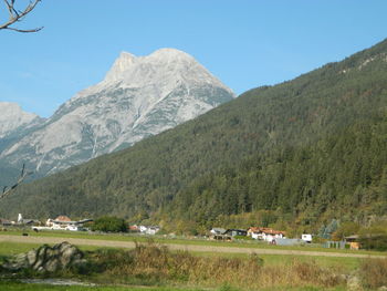 Scenic view of landscape and mountains against sky