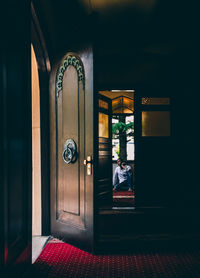 Man on door of entrance