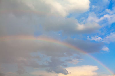 Low angle view of rainbow in sky