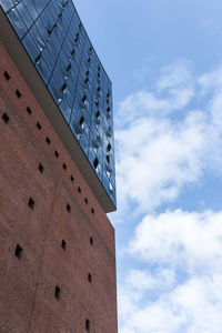 Low angle view of skyscraper against sky