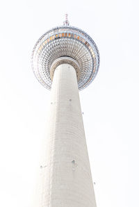 Low angle view of communications tower against sky