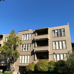Low angle view of building against clear blue sky