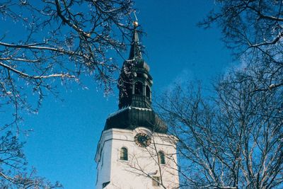 Low angle view of statue against blue sky