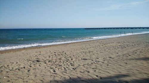 Scenic view of beach against clear sky