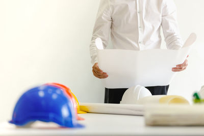 Man working on white table