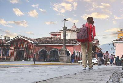 Rear view of woman walking on street