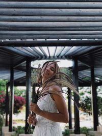 Full length of woman standing against the wall