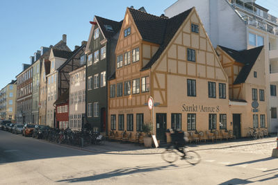 Buildings by road in city