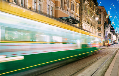 Blurred motion of train at railroad station