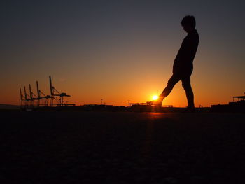 Silhouette of man at sunset