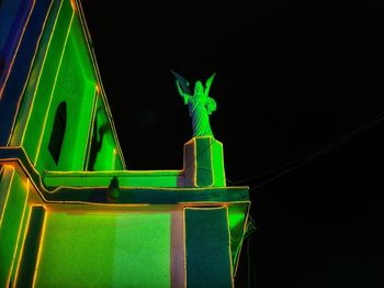 Close-up of a statue against dark background