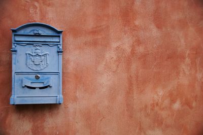 Mailbox on orange wall