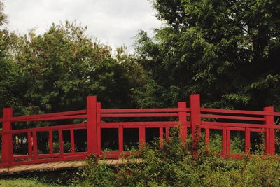 Red built structure against trees