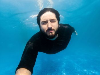 Portrait of man swimming in sea