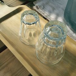 High angle view of wine glasses on wooden table