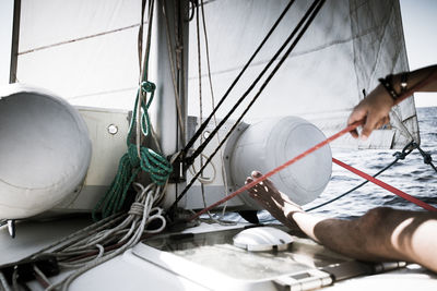 Close-up of hand holding sailboat