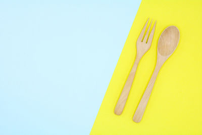 Close-up of yellow object over white background