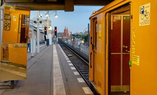 Train at railroad station against sky