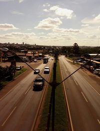 High angle view of vehicles on road against sky
