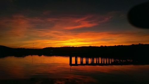 Scenic view of lake at sunset