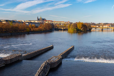 Vltava river and prague castle at the background in autumn