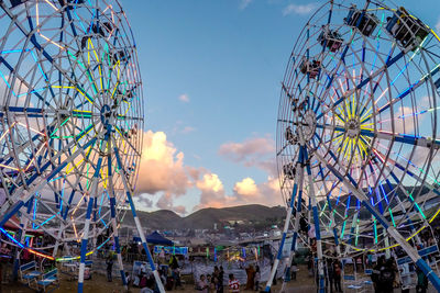 Low angle view of ferris wheel against sky