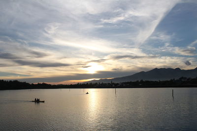 Scenic view of lake against sky during sunset