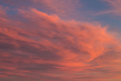 Low angle view of cloudy sky at sunset