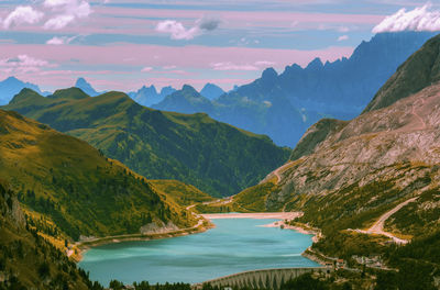 Scenic view of lake and mountains against sky