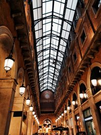 Low angle view of illuminated ceiling in shopping mall