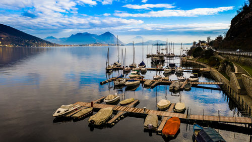 High angle view of boats moored in lake against sky