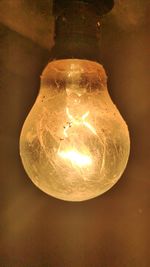 Close-up of illuminated light bulb