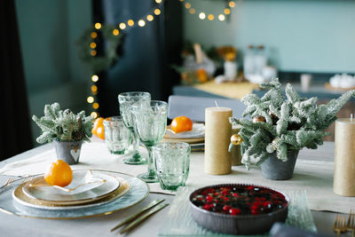 Table served for christmas dinner in living room, close-up view, table setting, christmas