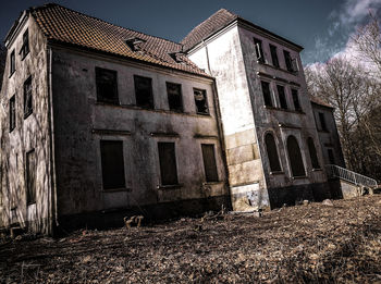 Abandoned building against sky