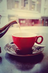 Close-up of coffee cup on table